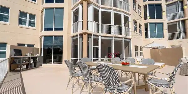 Image 2: Private 2000 sq ft Patio / Terrace  sunroom, outdoor dining area, and a patio
