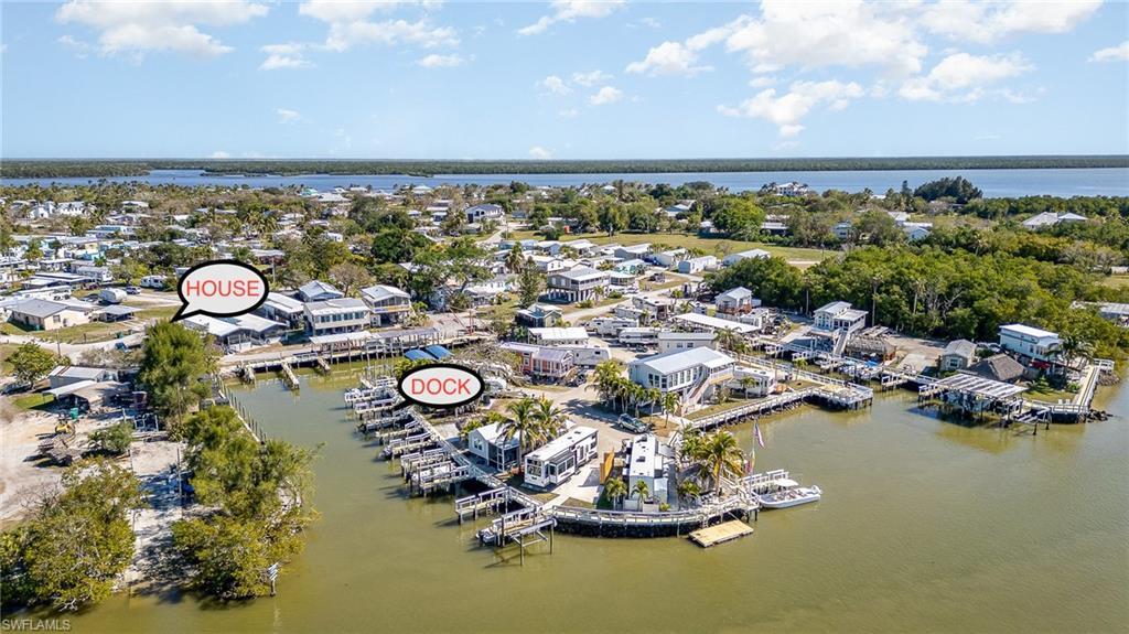 Image 3: Aerial view of property's location with a nearby body of water