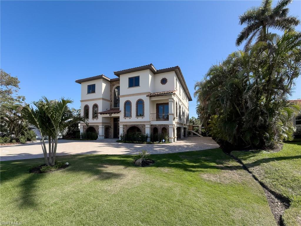 Image 2: Mediterranean / spanish-style house with a balcony, stucco siding, a front yard, and a tile roof