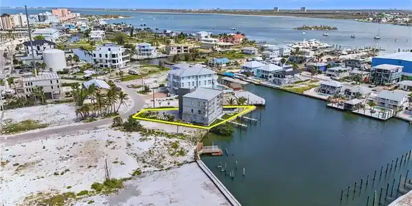 Image 3: Bird's eye view of property on lagoon - VIRTUALLY EDITED
