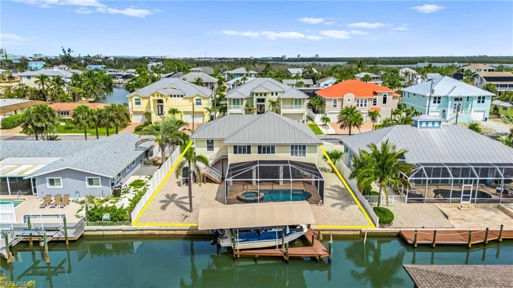 Image 1: Aerial view of rear side of house- virtually enhanced