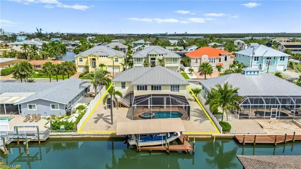 Image 1: Aerial view of rear side of house- virtually enhanced