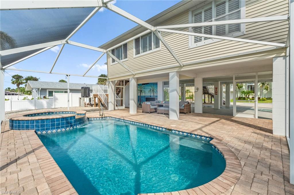 Image 3: Sparkling swimming pool with screened in lanai-Virtually enhanced