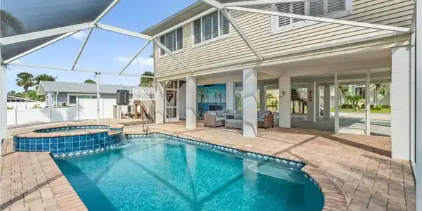 Image 3: Sparkling swimming pool with screened in lanai-Virtually enhanced