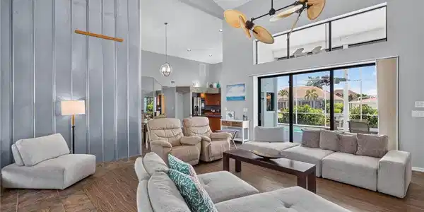 Image 2: Large open living area with ultra high ceilings