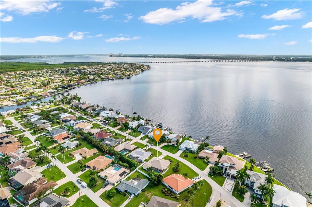 Image 1: Aerial overview of property's location with the Caloosahatchie River to the East and the Horton Park Boat ramp just a few minutes away. View of Ft Myers to the East