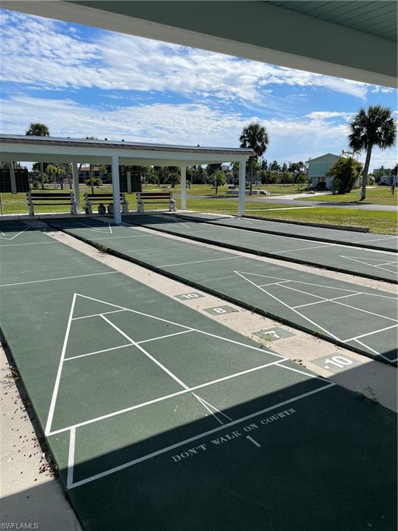 Image 4: Surrounding community featuring shuffleboard and a yard