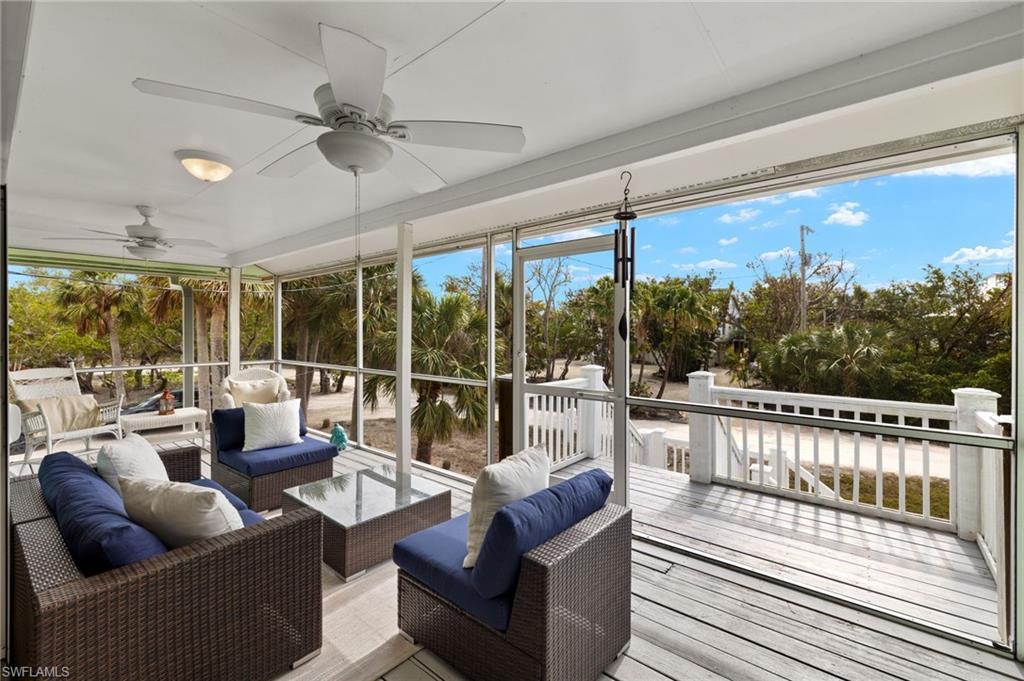 Image 4: Sunroom / solarium with an outdoor living space, a ceiling fan, a deck, and healthy amount of natural light