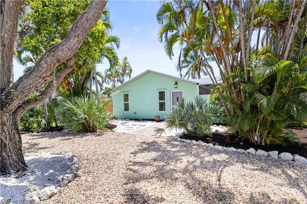 Image 2: Nestled between the beautiful white sandy beaches and the Sanibel restaurants and shopping areas is this darling cottage that has been restored to perfection!