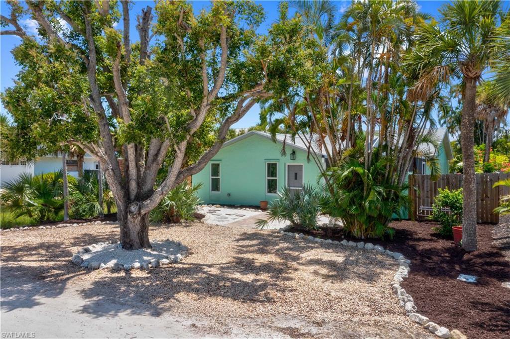 Image 3: Nestled between the beautiful white sandy beaches and the Sanibel restaurants and shopping areas is this darling cottage that has been restored to perfection!