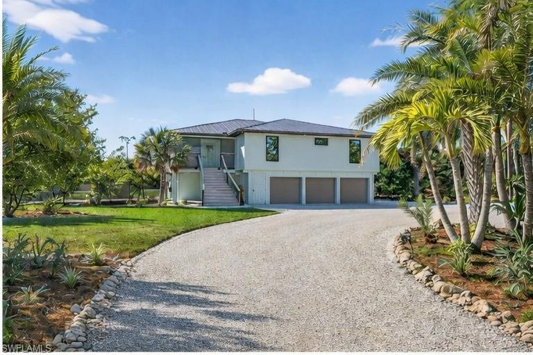 Image 1: Private Gated Entrance to 1211 Periwinkle Way
