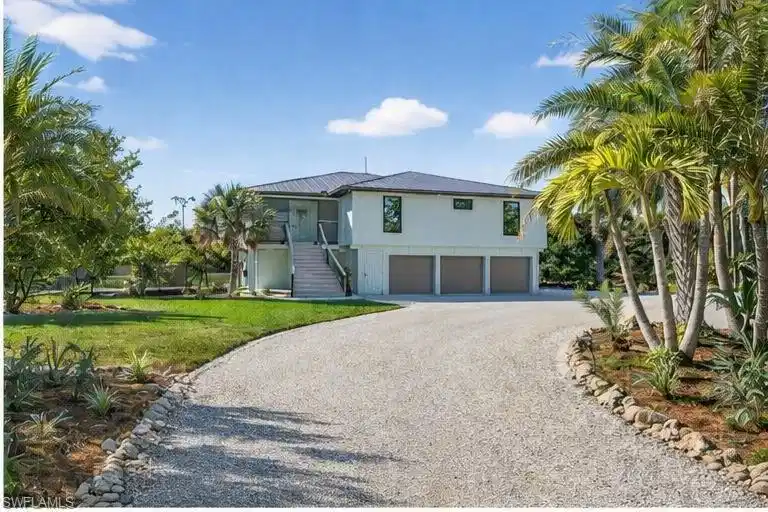 Image 1: Private Gated Entrance to 1211 Periwinkle Way