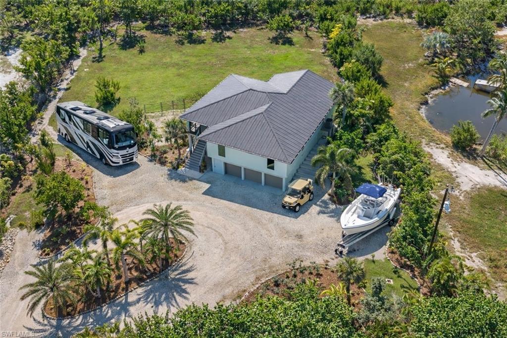 Image 2: Three separate parking pads around an extra-large, spacious circular driveway. Plenty of Room for all your Big Toys