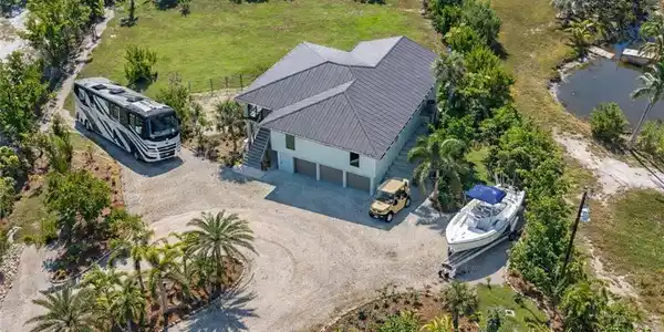 Image 2: Three separate parking pads around an extra-large, spacious circular driveway. Plenty of Room for all your Big Toys
