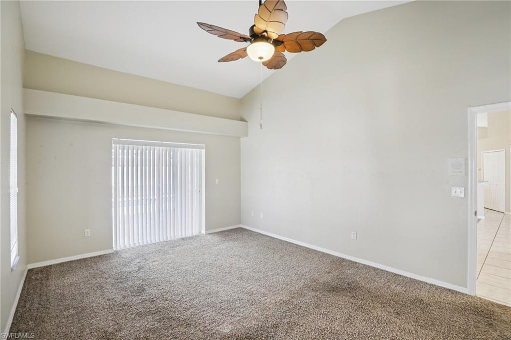 Image 4: Empty room featuring carpet flooring, ceiling fan, and lofted ceiling