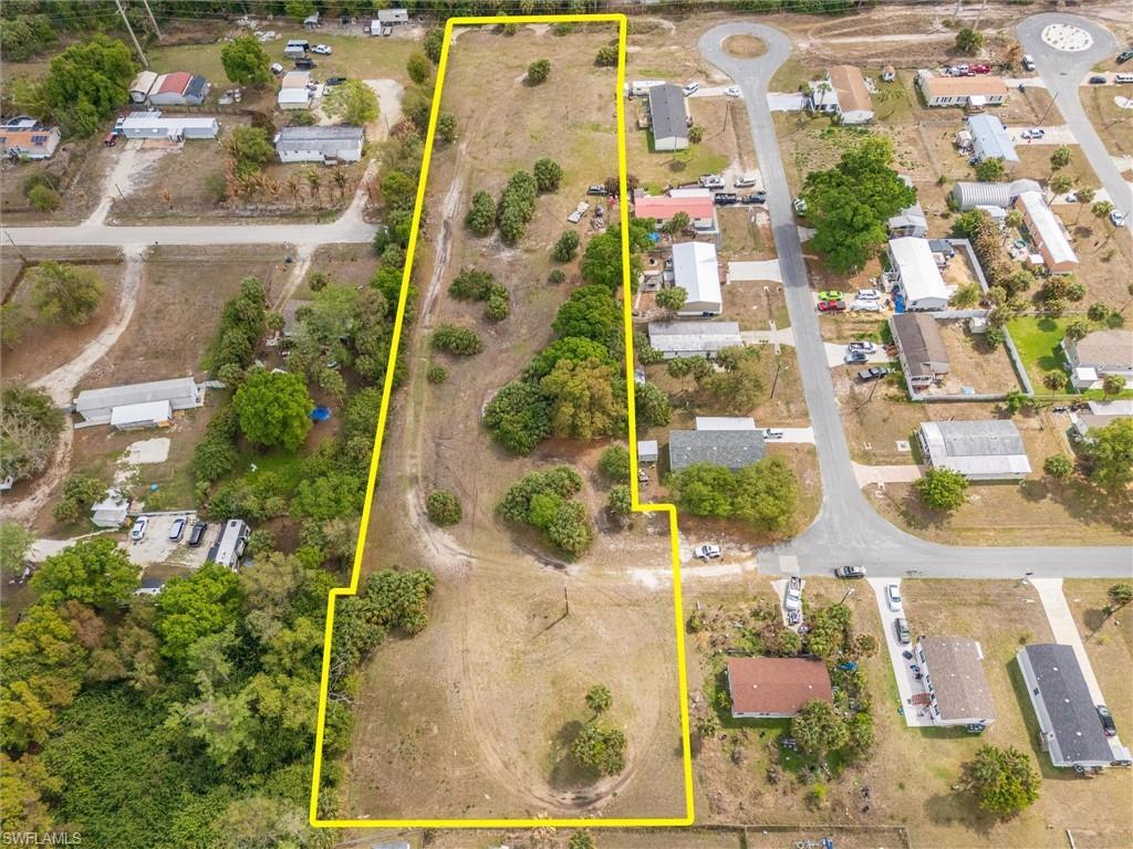 Image 2: Aerial perspective of suburban area featuring property boundaries highlighted