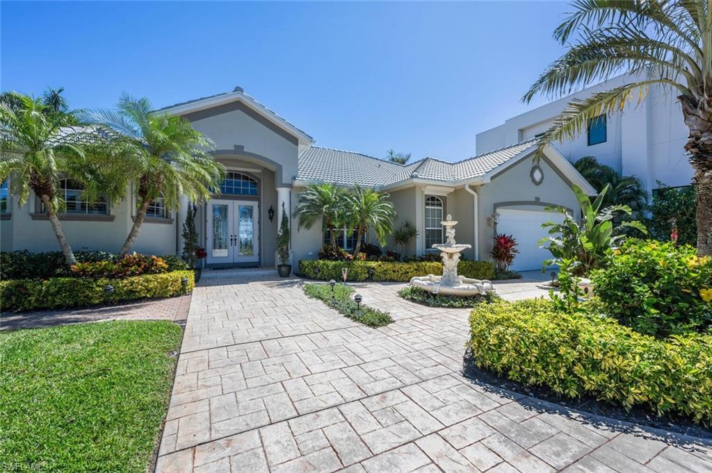 Image 4: FRONT OF HOME W/OVERSIZED GARAGE