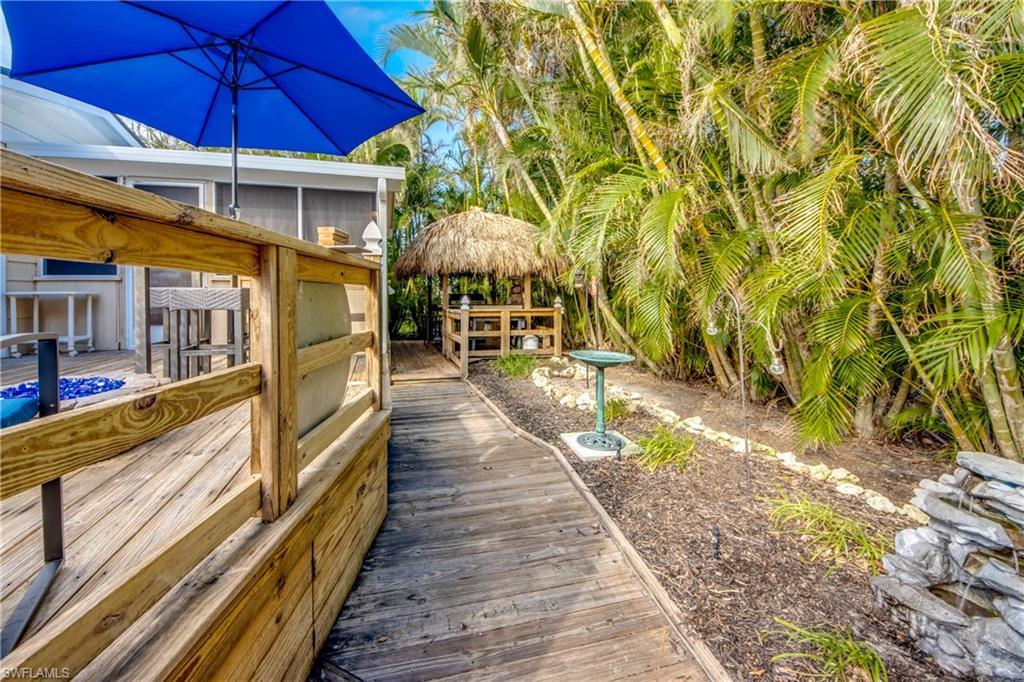 Image 4: Wooden terrace featuring a sunroom
