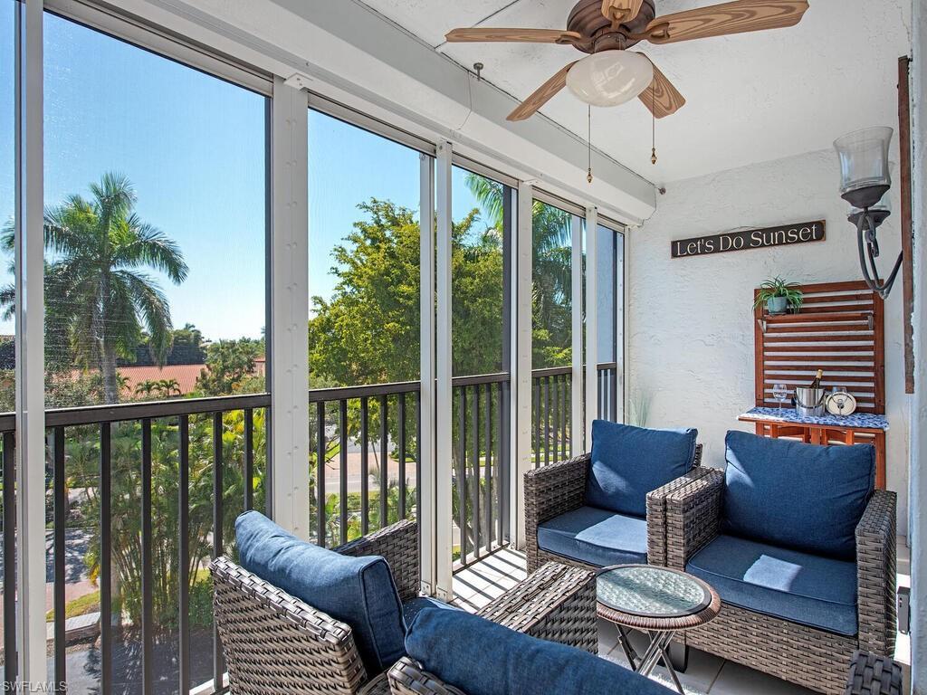 Image 1: Sunroom featuring a ceiling fan and a balcony