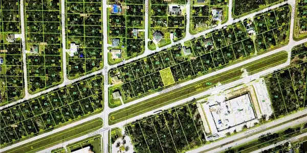 Image 2: Aerial overview of property's location featuring property boundaries highlighted