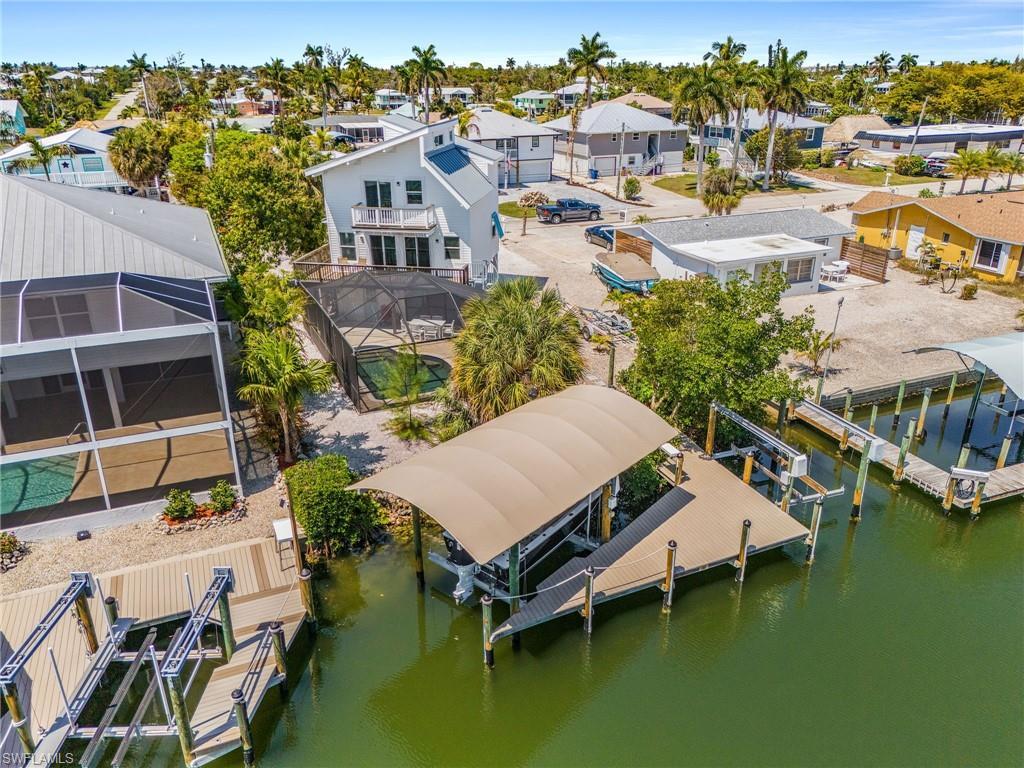 Image 2: There are 2 lifts for your boating pleasure, plus a boat ramp.  There are also 2 decks on the rear of the home for beautiful views across St. James City.