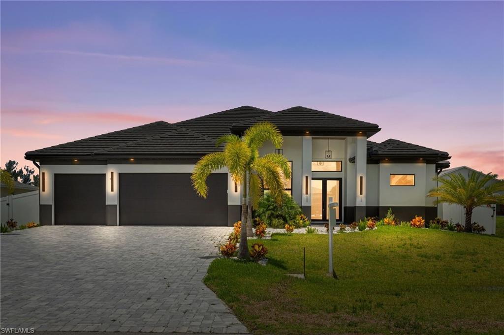 Image 2: STRIKING EXTERIOR PALETTE of CHARCOALGRAY, BLACK, and CRISP WHITE, this NEWCONSTRUCTION HOME blends BOLD CURBAPPEAL with ELEGANT DESIGN, inviting you toown a piece of paradise!