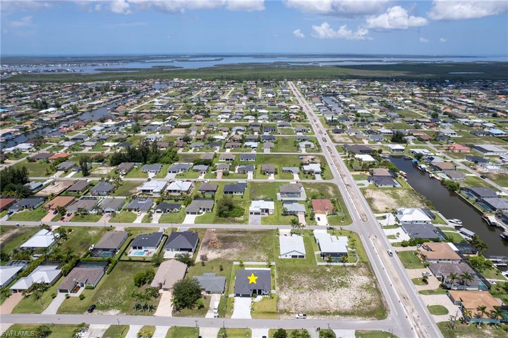 Image 4: Located near the upcoming SEVEN ISLANDSWATERFRONT COMMUNITY in NW Cape Coral,featuring future marinas, parks, dining, andresort-style amenities, this property offersINCREDIBLE POTENTIAL!!!