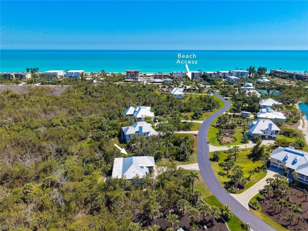 Image 2: Coastal community featuring direct beach access, paved roadways, and modern architecture