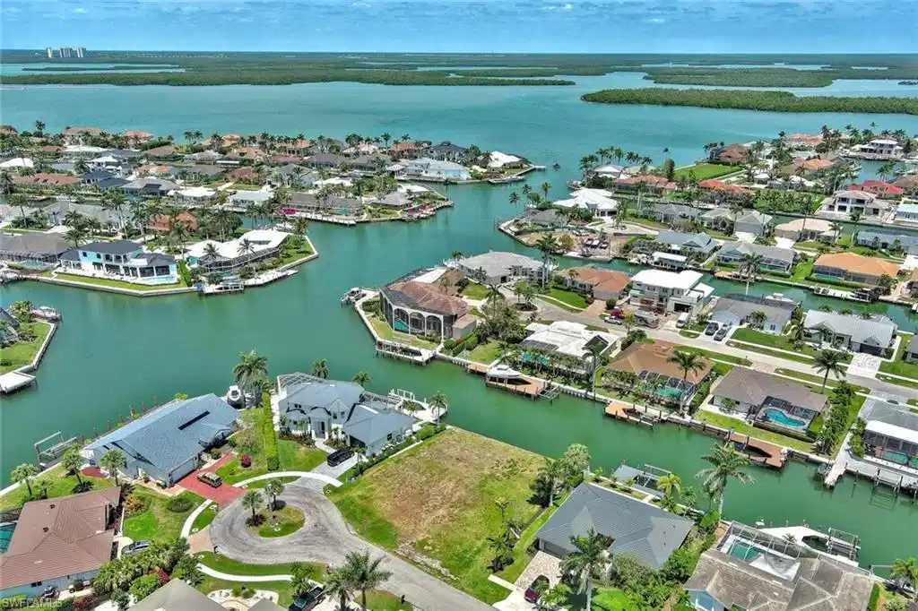Image 1: Birds eye view of property with a water view and a residential view