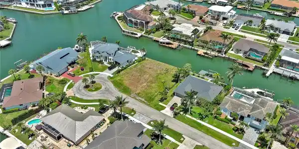 Image 3: Birds eye view of property featuring a residential view and a water view