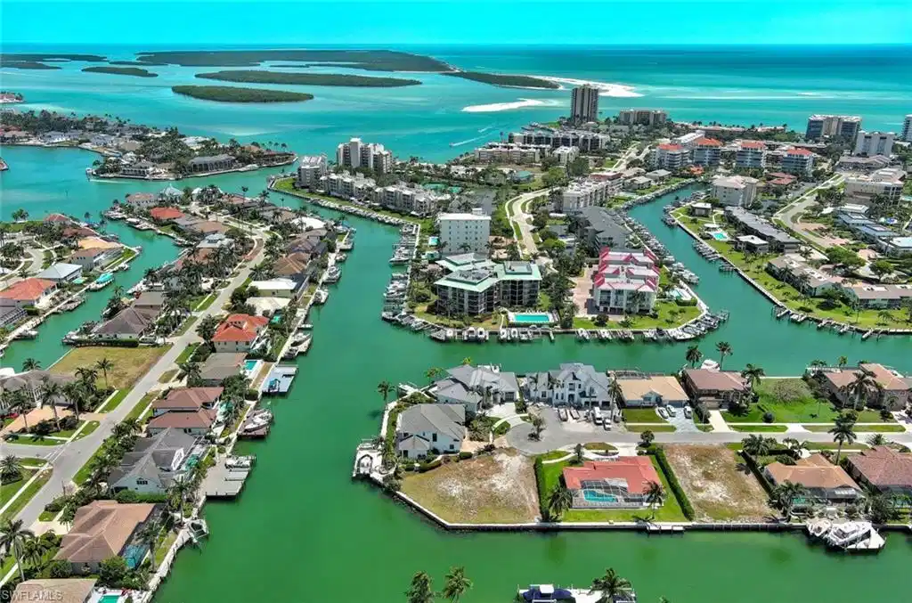 Image 1: Bird's eye view featuring a city view and a water view