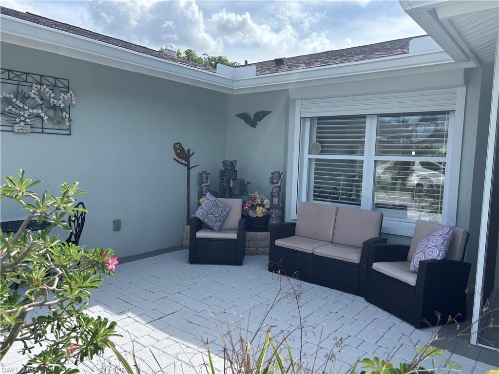Image 3: View of patio featuring an outdoor hangout area