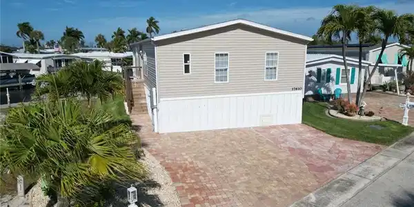 Image 4: View of side of property featuring stairway