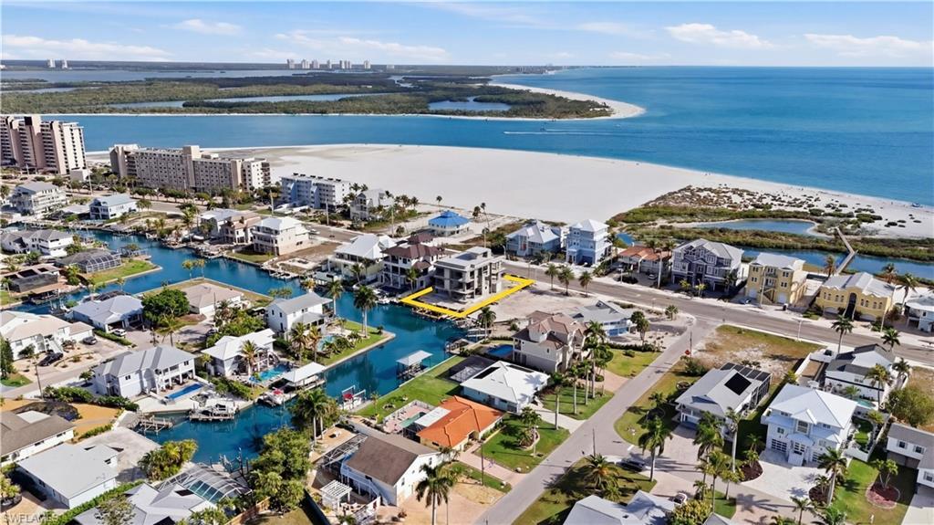Image 3: Aerial perspective of suburban area with a nearby body of water - Virtually Edited Image
