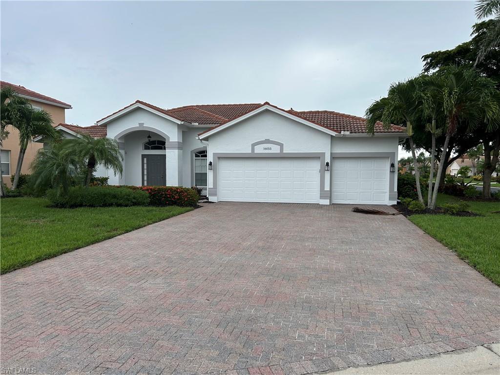 Image 1: Single level home, spacious paved driveway and 3 car garage