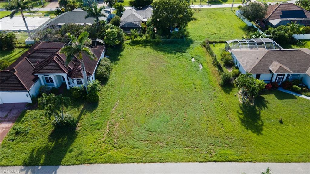 Image 1: Aerial view of property and surrounding area