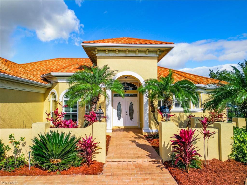 Image 4: Mediterranean / spanish-style house with stucco siding and a tiled roof