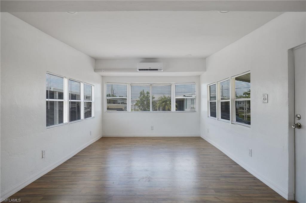 Image 3: Unfurnished room with baseboards, a wall mounted AC