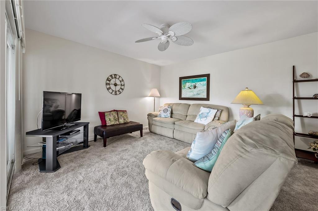 Image 4: Living room with carpet and a ceiling fan