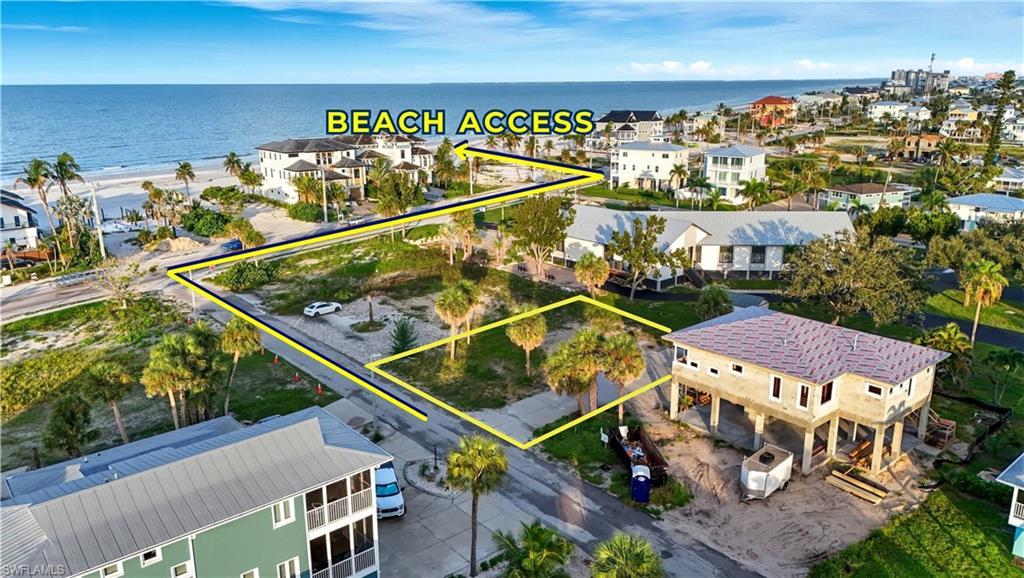 Image 1: Aerial view of property's location with a large body of water and property boundaries highlighted - Virtually Edited Image