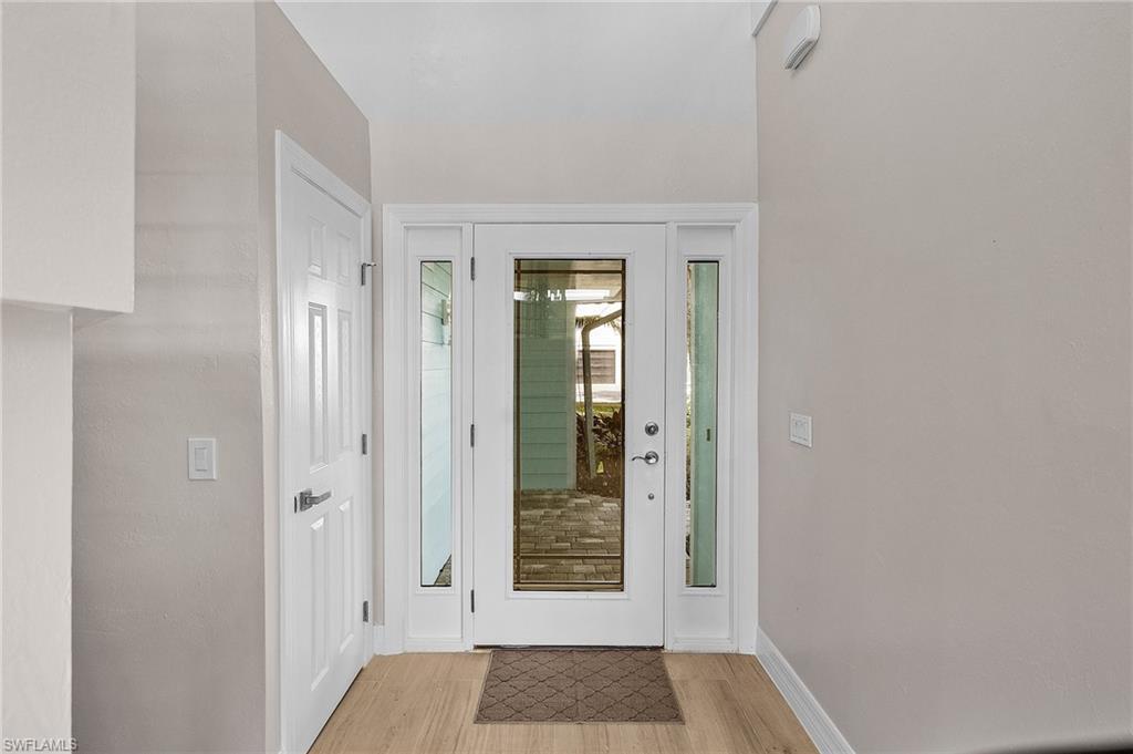 Image 4: Entryway featuring light wood finished floors and baseboards