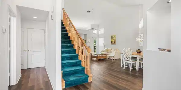 Image 2: The entry offers a broad view of the home, with easy paths of travel to the great room, kitchen, guest room, and upstairs.