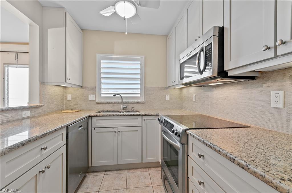 Image 2: Updated with custom cabinetry and granite countertops