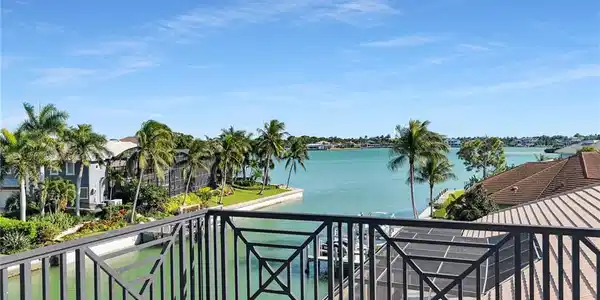 Image 3: Balcony featuring a decorative black metal railing and expansive water frontage view of  Roberts Bay