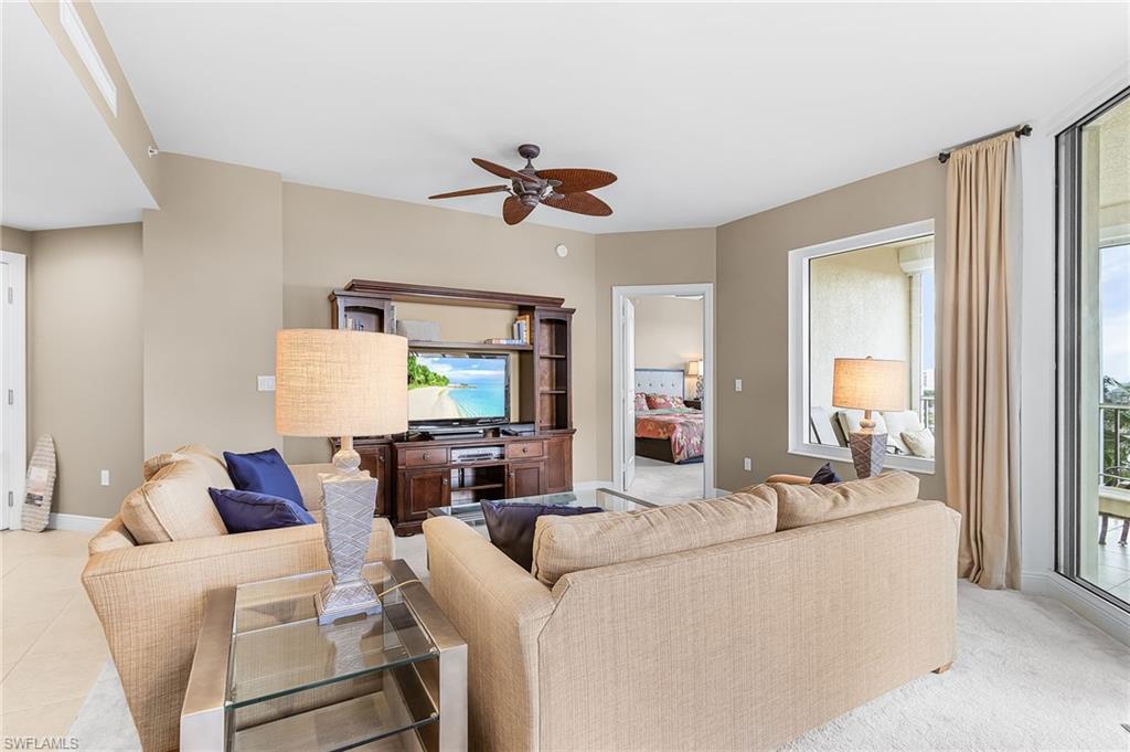 Image 3: Living room featuring healthy amount of natural light, a ceiling fan, and light tile patterned floors