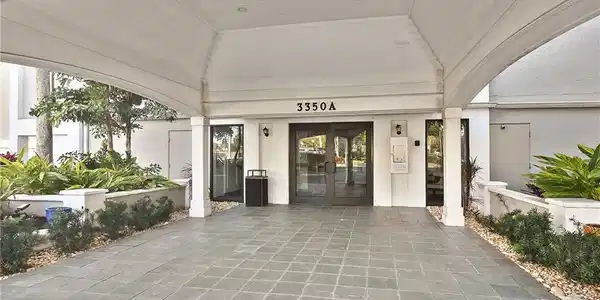 Image 3: Entrance to property with french doors and stucco siding
