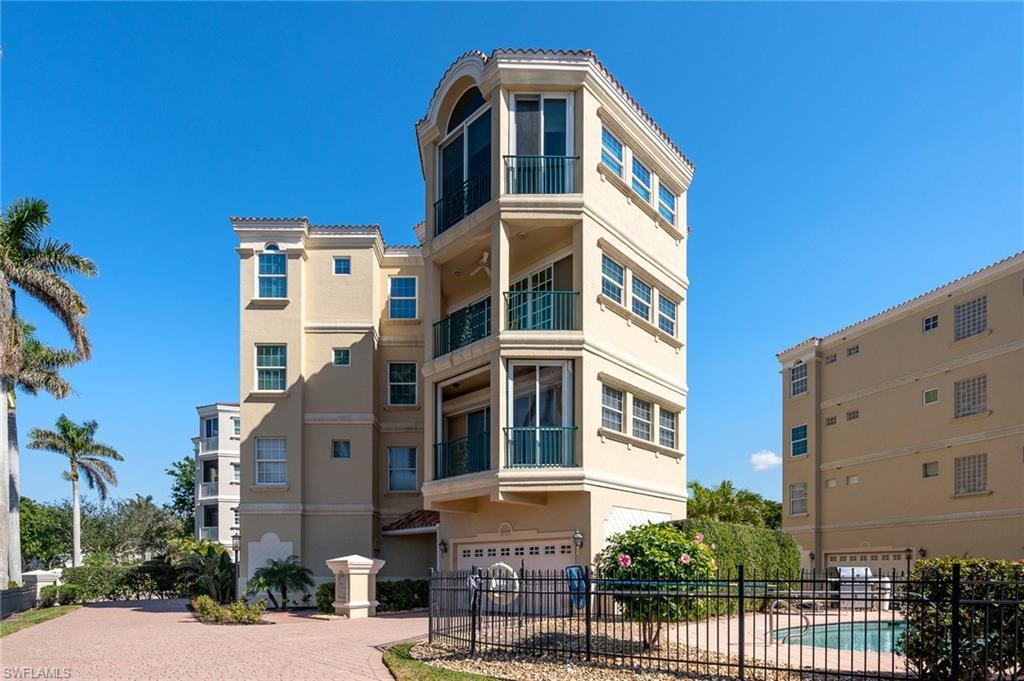 Image 1: View of apartment building / complex with an attached garage and decorative driveway
