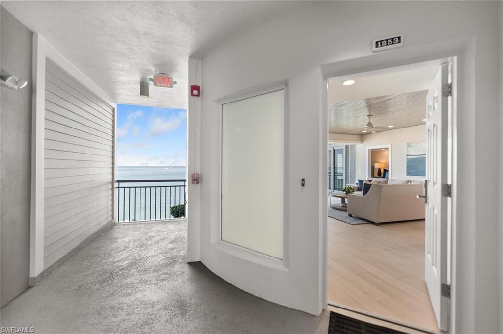 Image 3: Corridor with a water view and concrete floors