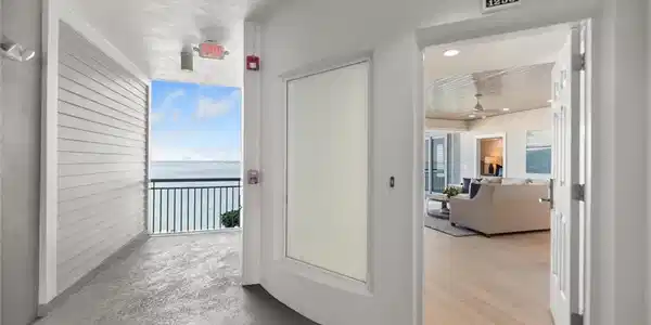 Image 3: Corridor with a water view and concrete floors