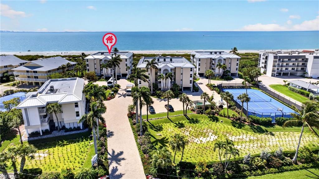 Image 3: The property is situated directly on the beachfront, offering expansive views of the ocean